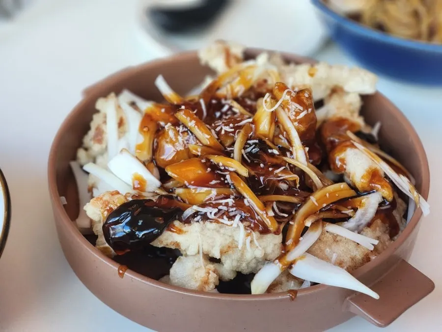A plate of black vinegar sweet and sour pork at Bueokgan Chinese