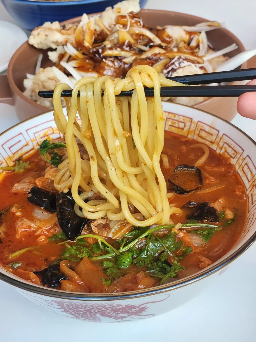 Close-up of the noodles and broth in mala coriander jjamppong