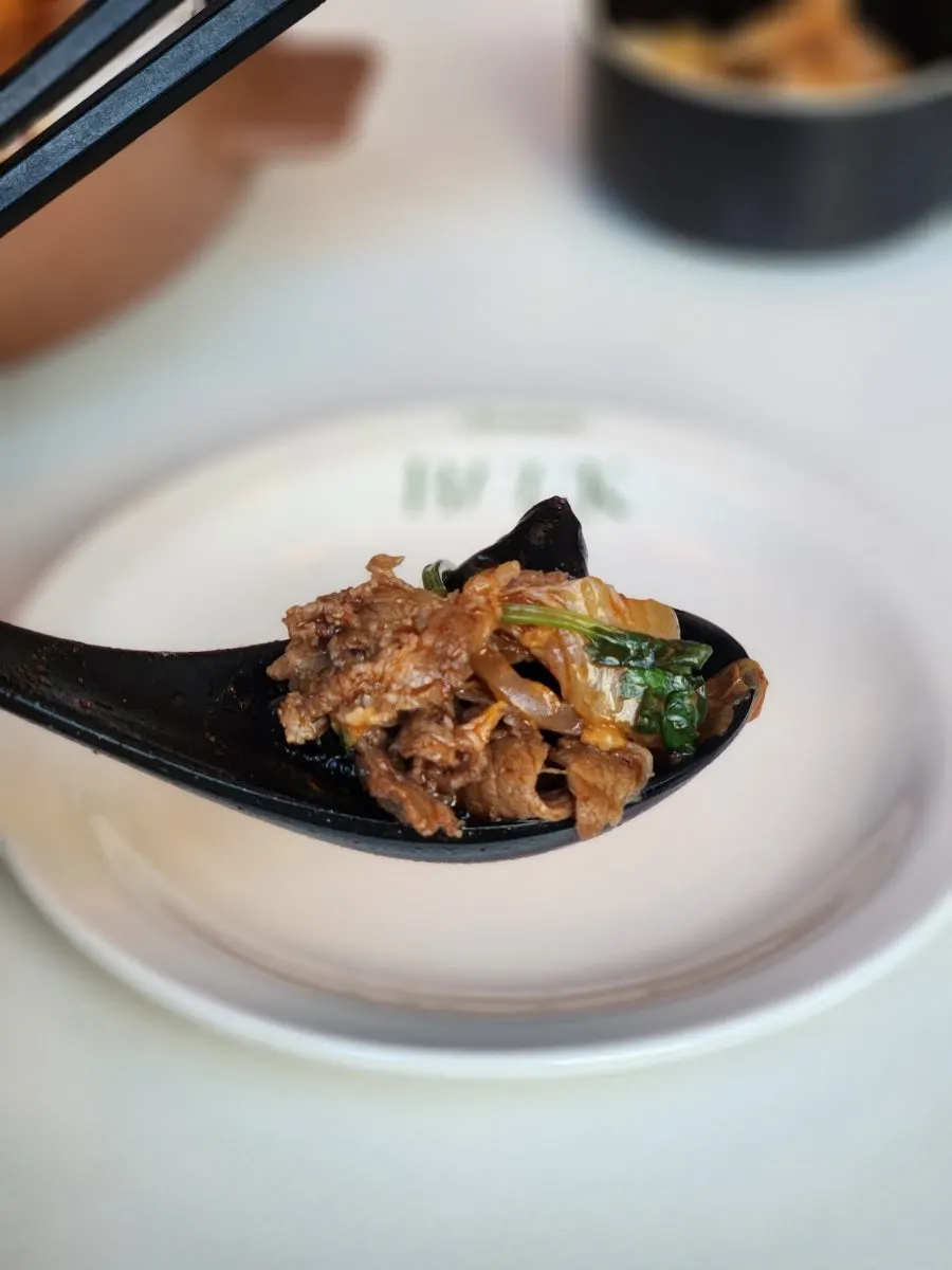 Noodles lifted from the mala coriander jjamppong