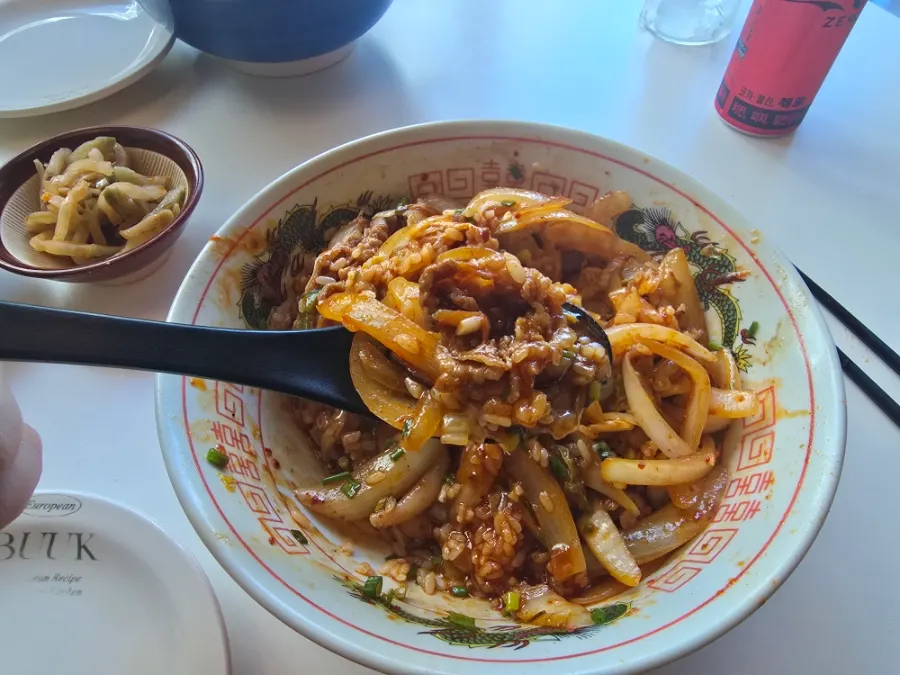 Bowl of spicy poached-egg octopus Chinese rice