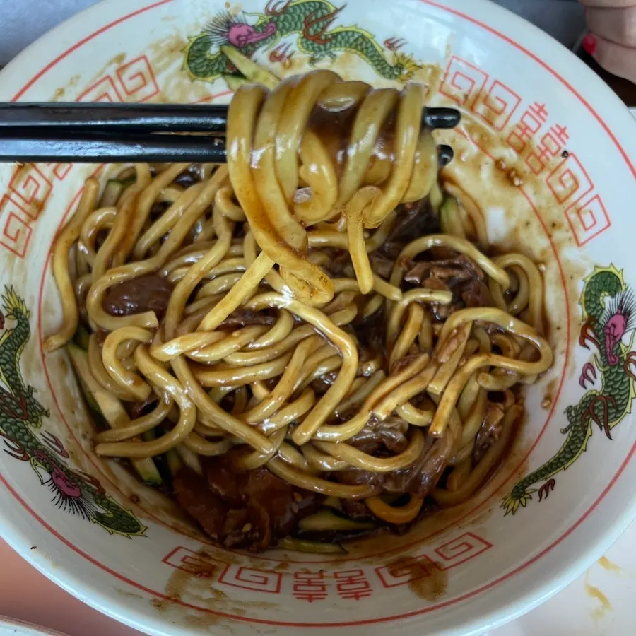 A Chinese meal spread with cola