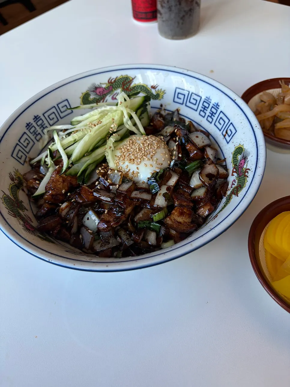 Popped poached egg mixed into jjajang sauce and noodles