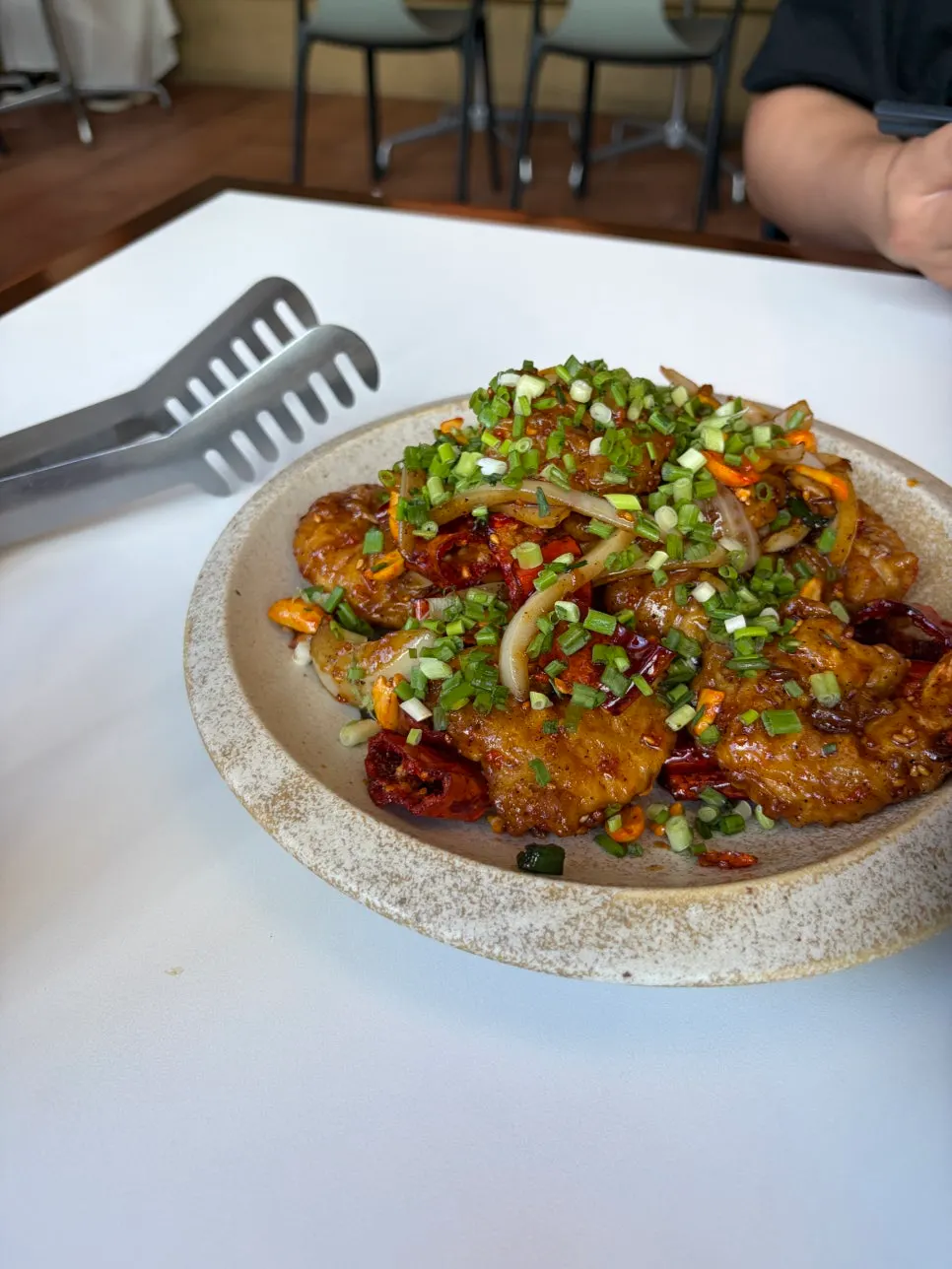 Plate of kkanpung shrimp with subtle mala seasoning