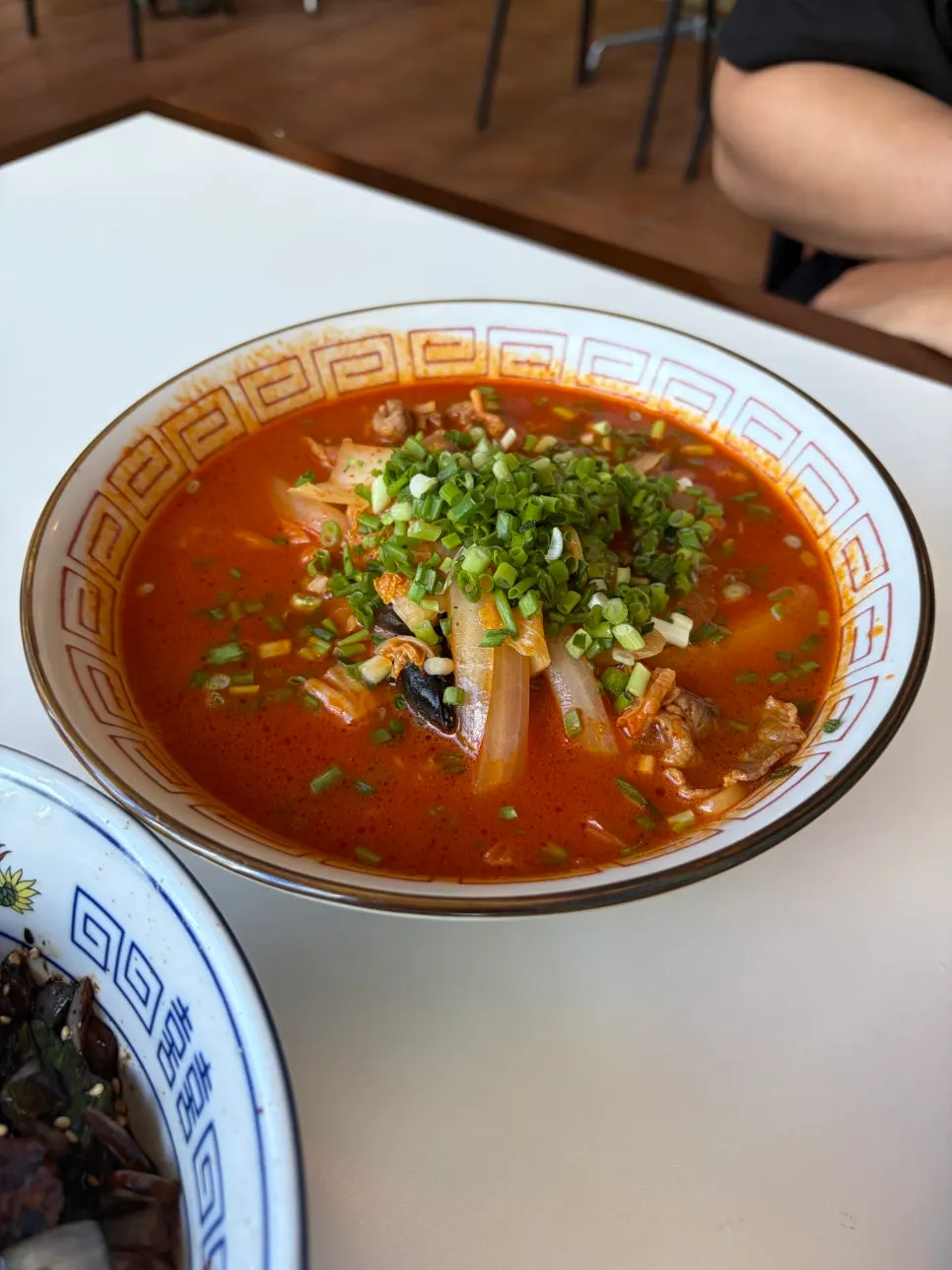 Beef belly jjamppong topped with beef and vegetables