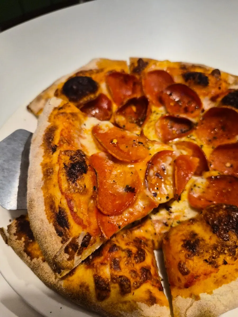 Pepperoni pizza piled generously with pepperoni