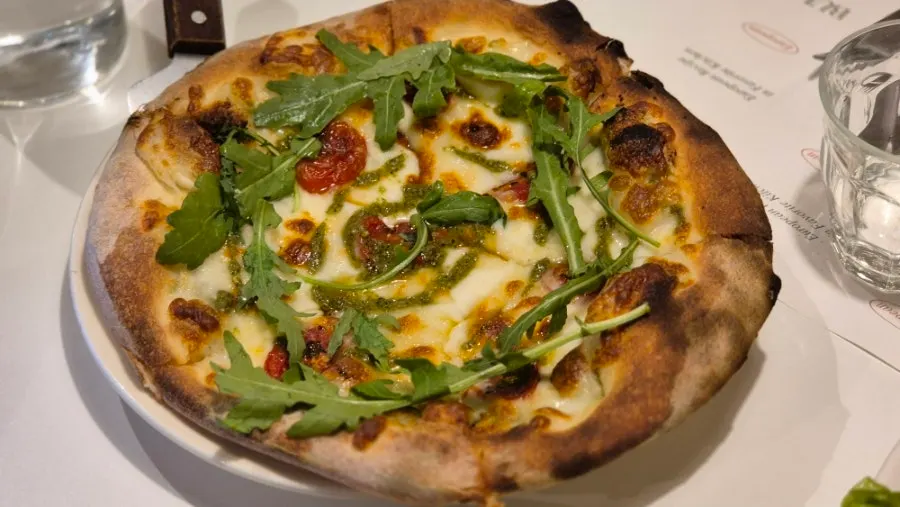 Basil margherita pizza piled high with cheese