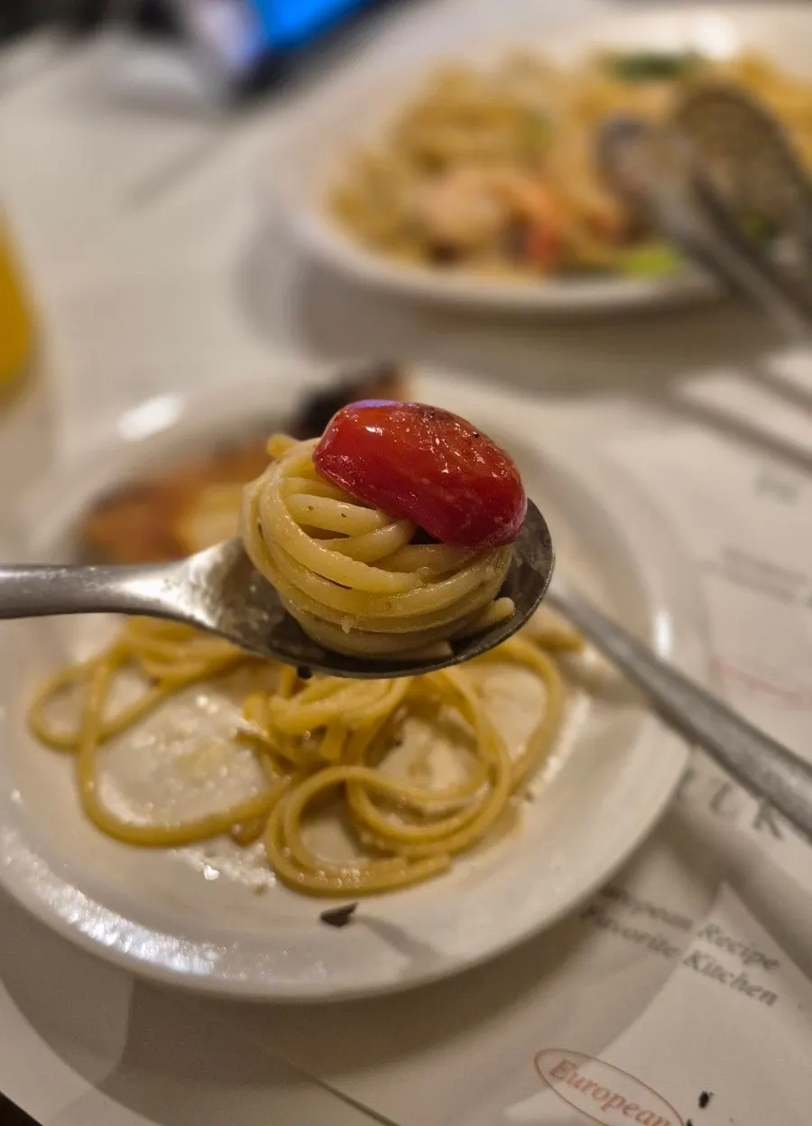 Plump shrimp on top of the oil pasta noodles