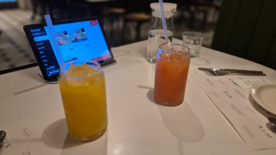 Orange juice and grapefruit juice ordered alongside the meal