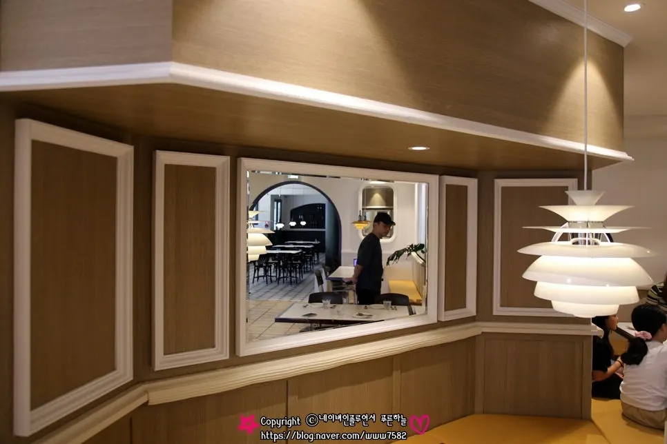 Hall at Bueokgan Haeundae Branch with wood and arched windows