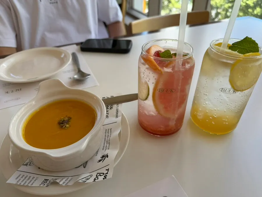 Pumpkin soup and two ades served first