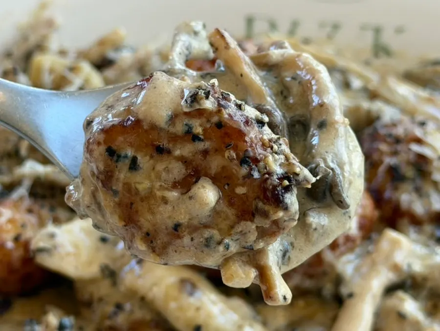 A spoonful of chewy gnocchi lifted up