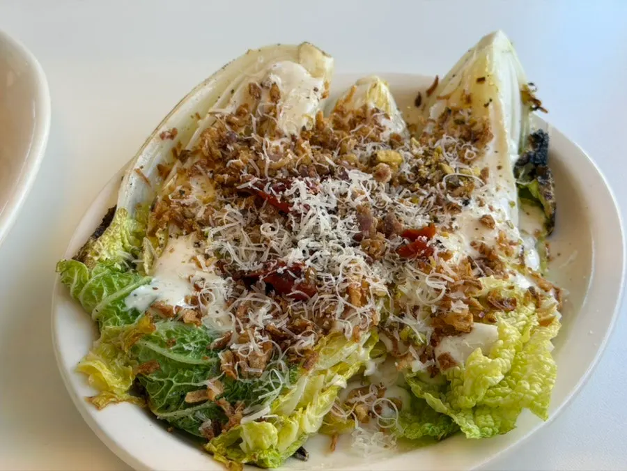 Napa cabbage Caesar salad cut with scissors