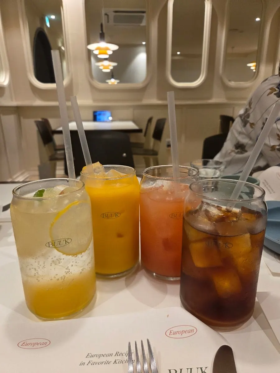 Several drinks lined up on the table