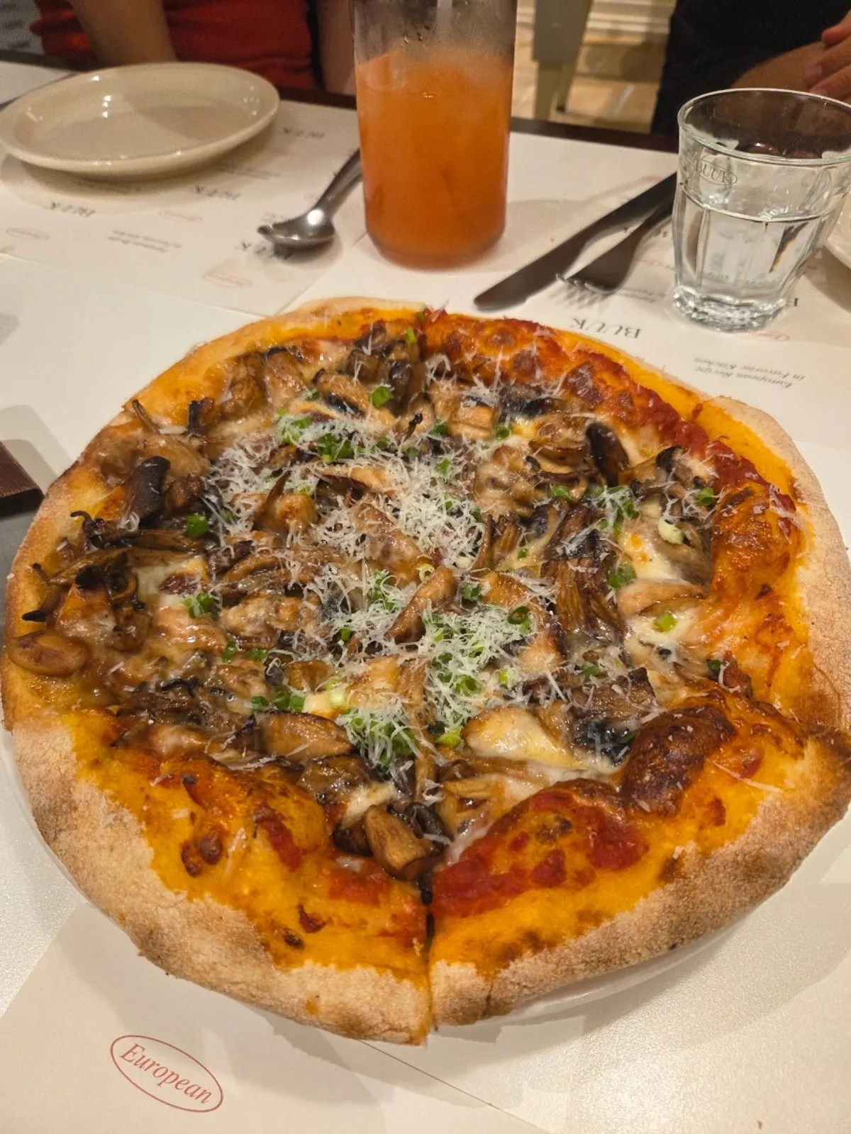 Truffle mushroom pizza fresh out of the wood-fired oven
