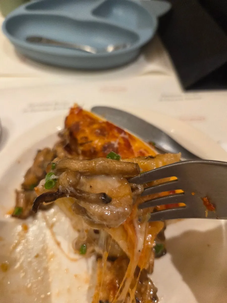 Pizza and drinks set out on the table