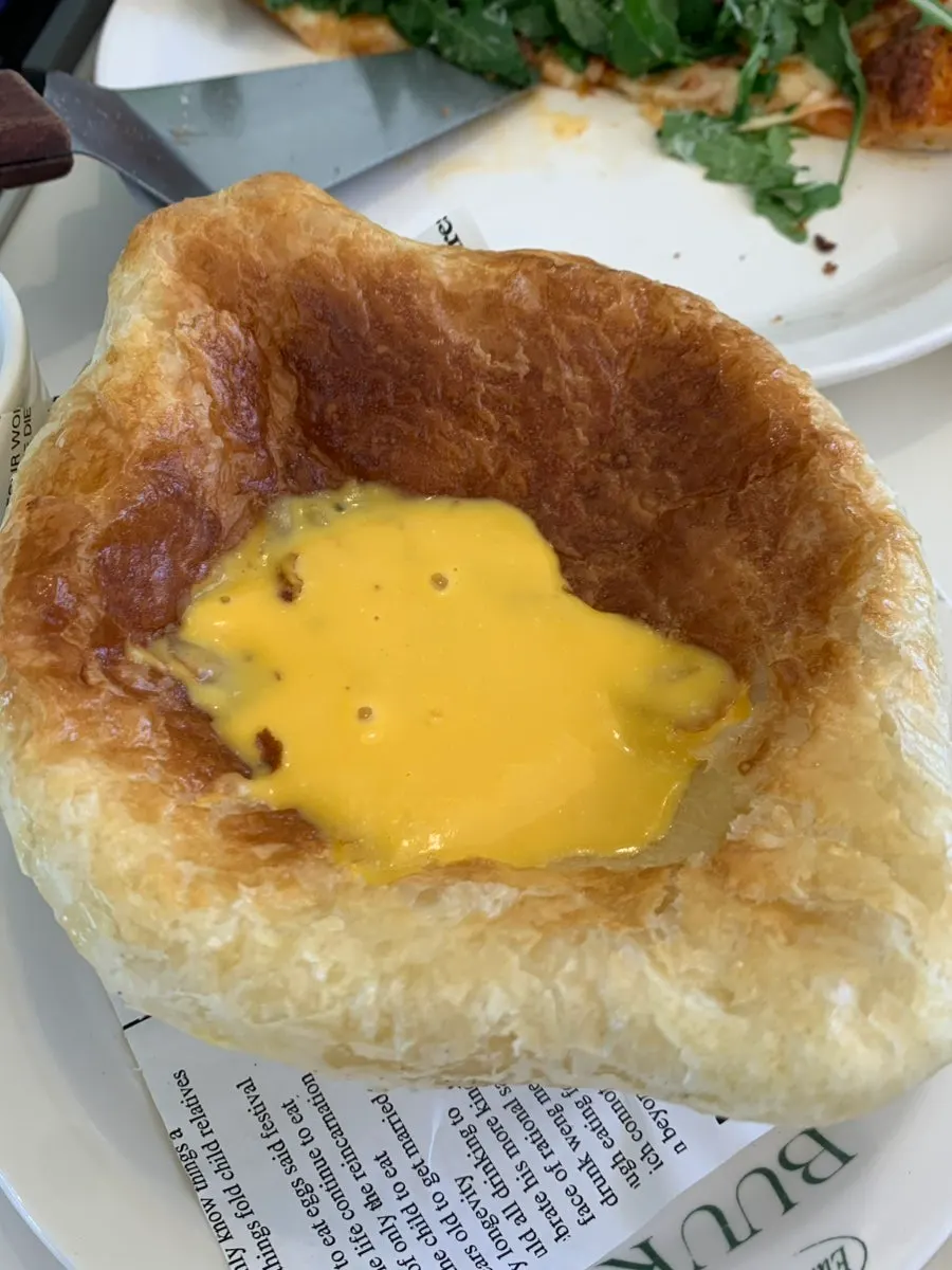 Pumpkin pastry soup covered with pastry