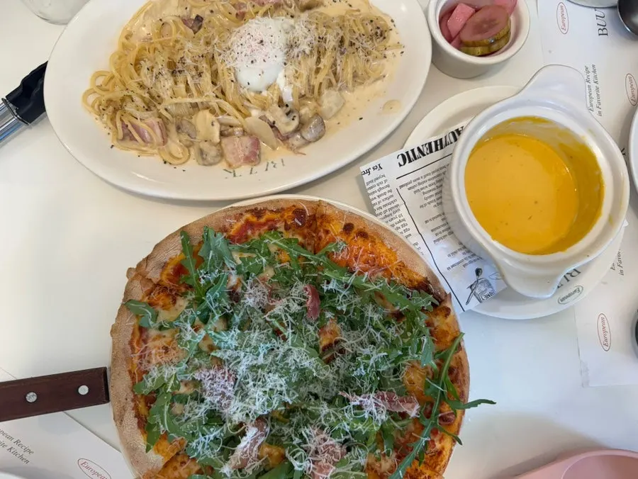 Pasta and pizza set out on the table