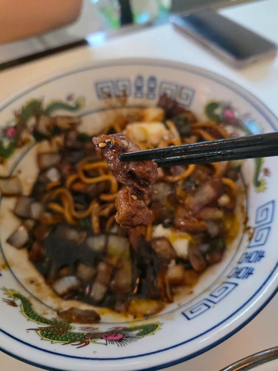 Jjajang sauce loaded with onions and meat