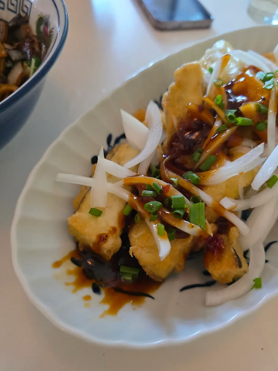 Plate of yuxiang eggplant served at the table