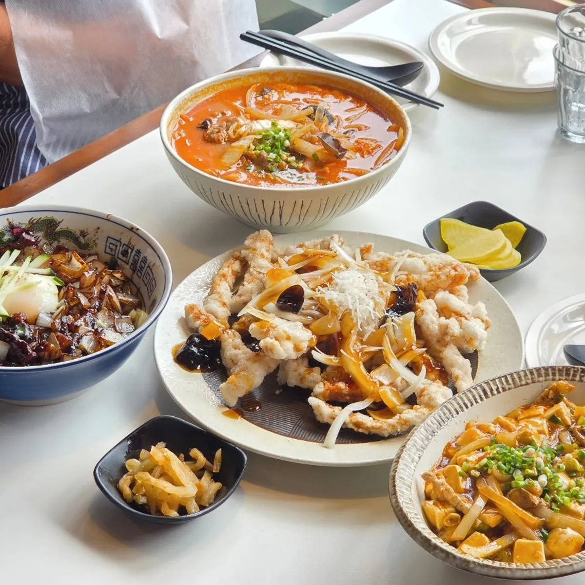 Full spread of jjamppong, jjajangmyeon, tangsuyuk, and mapo tofu rice bowl