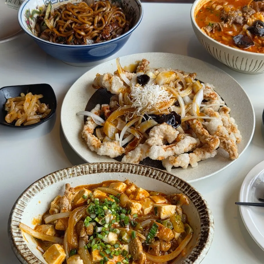Nearly empty plates of jjamppong and tangsuyuk