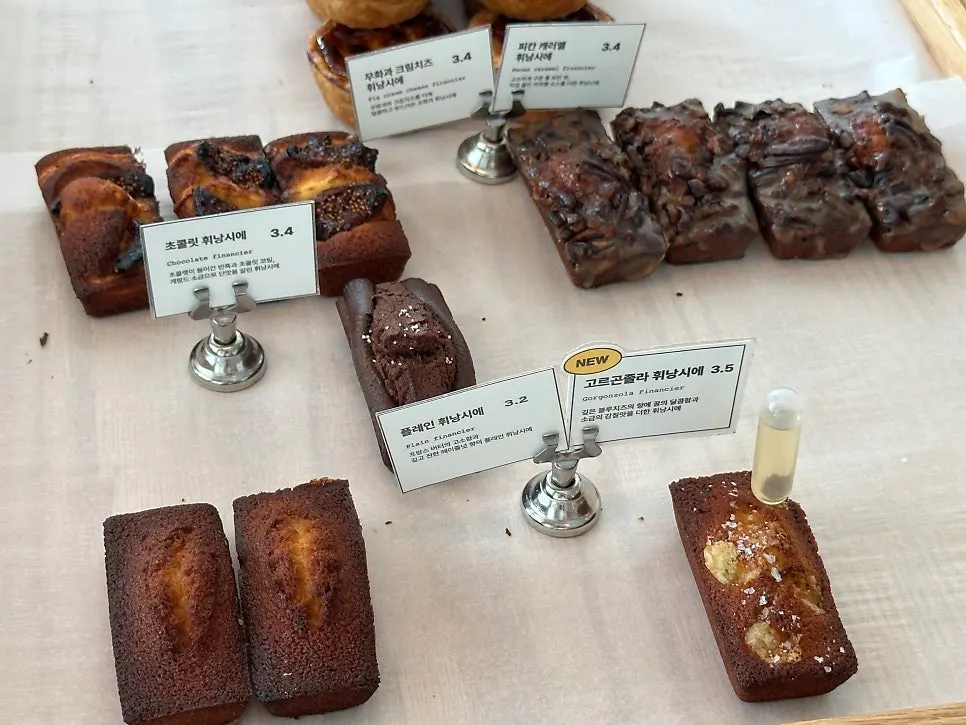 Display of egg tarts and financiers