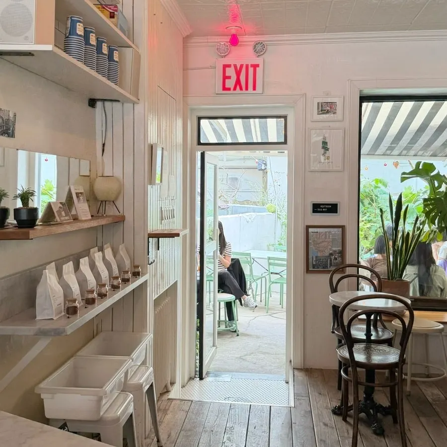 Wood-tone tables and ivory-tone interior space