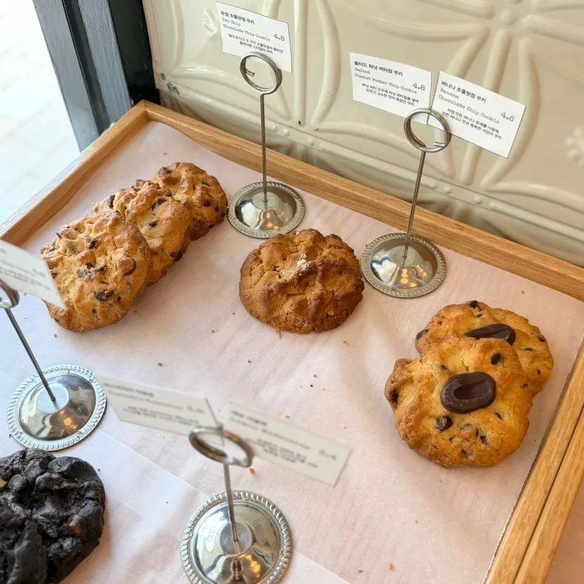 Madeleines and cookies with various toppings