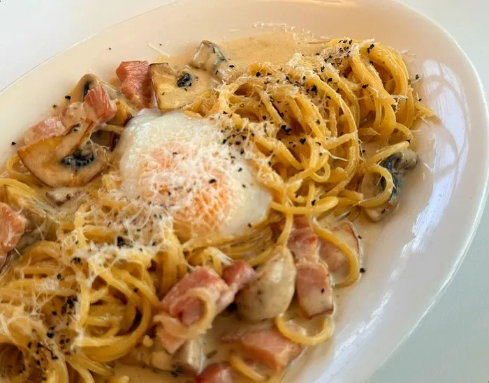 Close-up of rich cream sauce carbonara