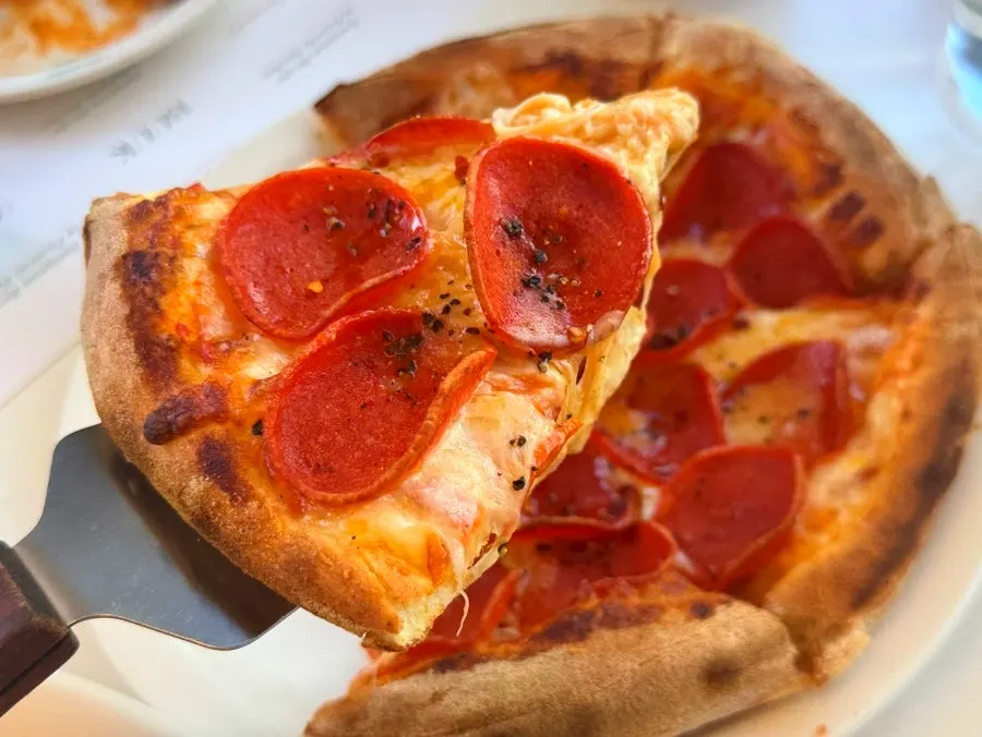 Pizza and pasta served together as part of the couple's dish set