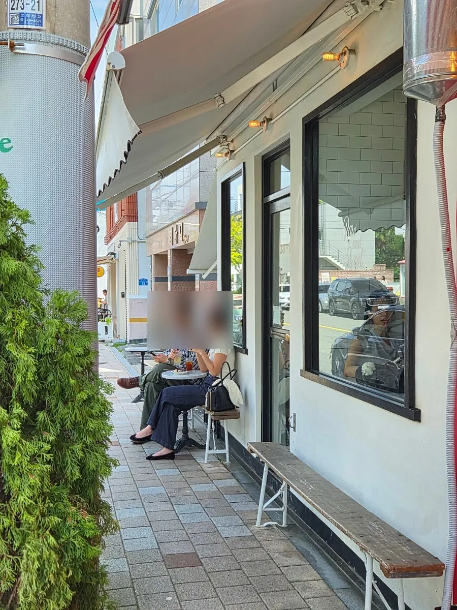 Outdoor seating area in front of the café