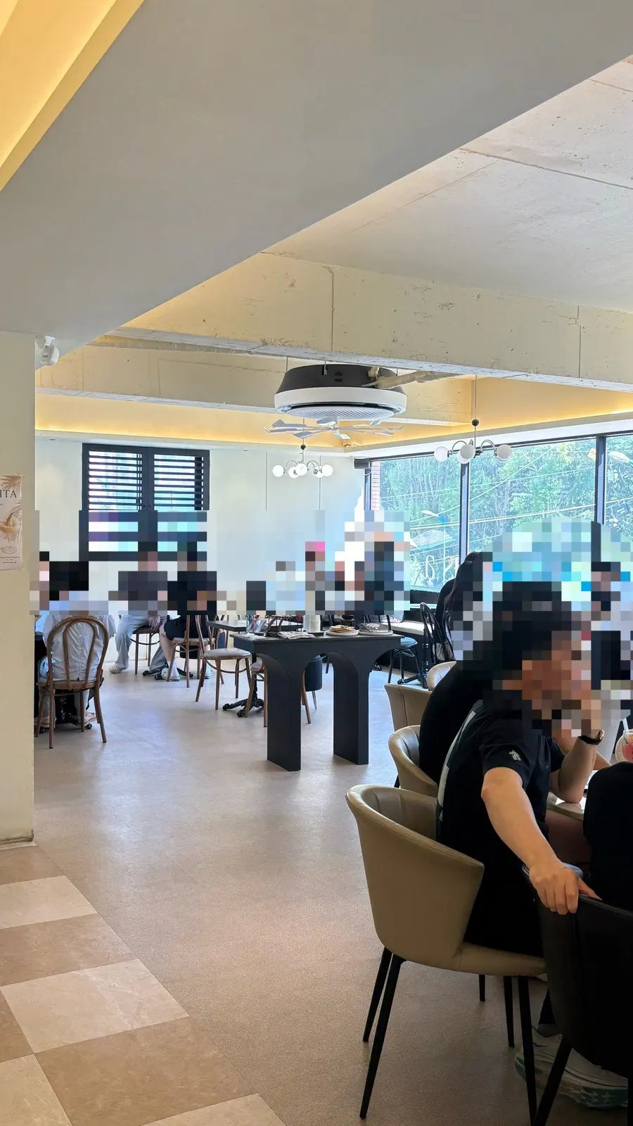 Second-floor seating at Geumsong Deokmi filled with customers