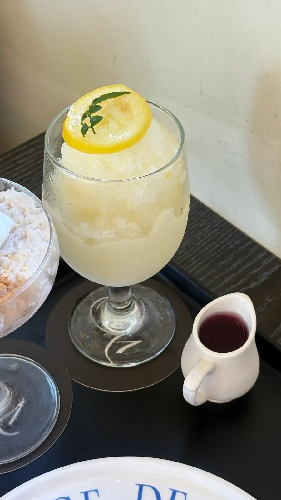 Lemon granita served with grape syrup