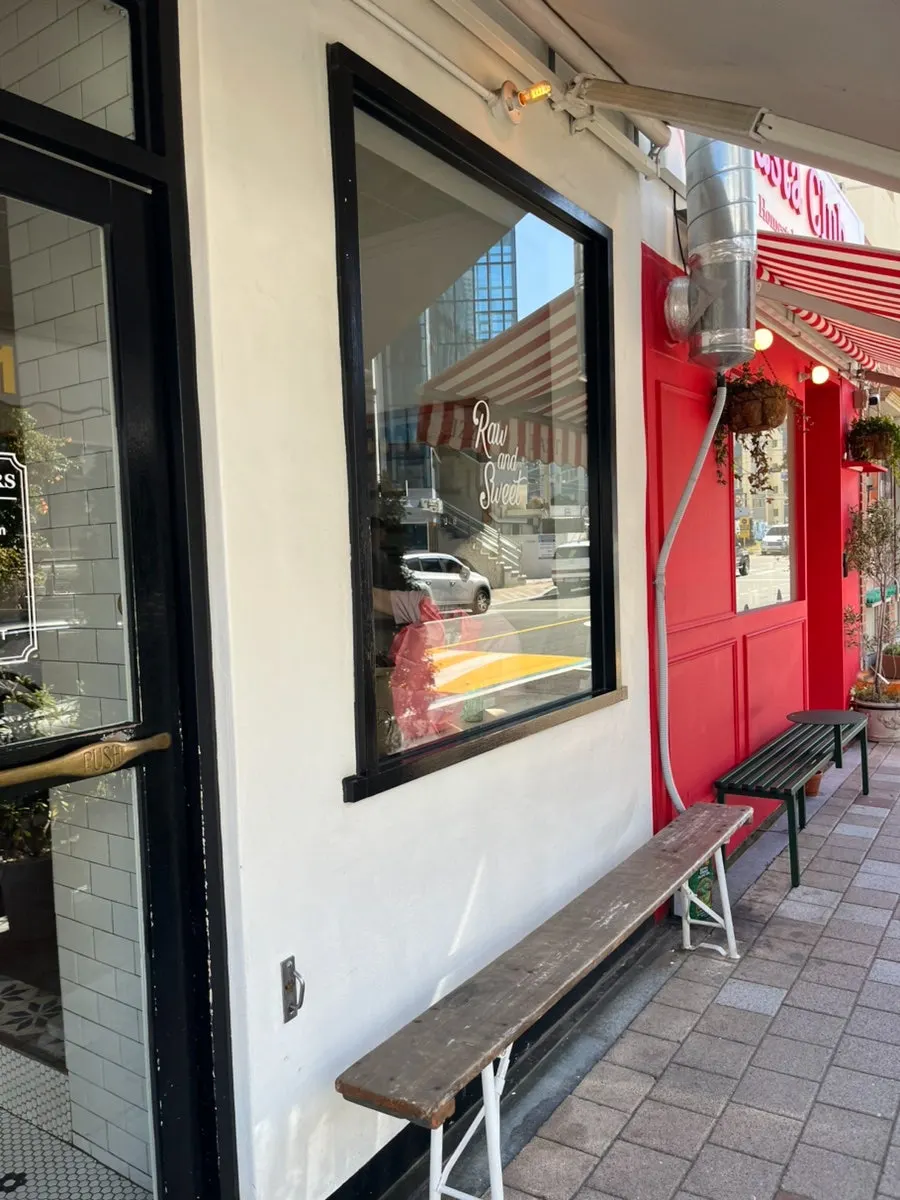 White-façade café entrance in the Haeri-dan-gil alley