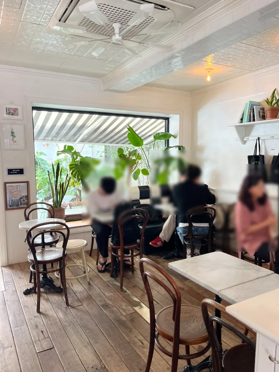 Café interior in wood and white tones