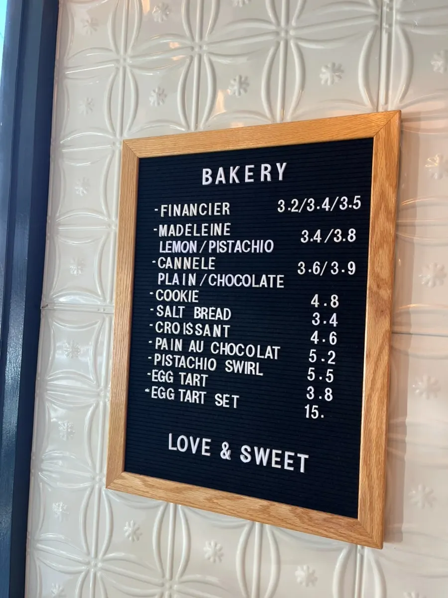 Display case with cookies, baked goods, and coffee beans