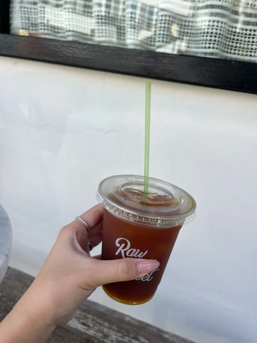 Vanilla bean latte in a takeout cup
