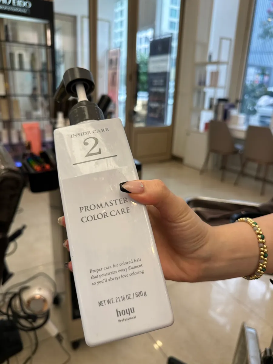 Step 2 clinic product applied to nourish inside the hair