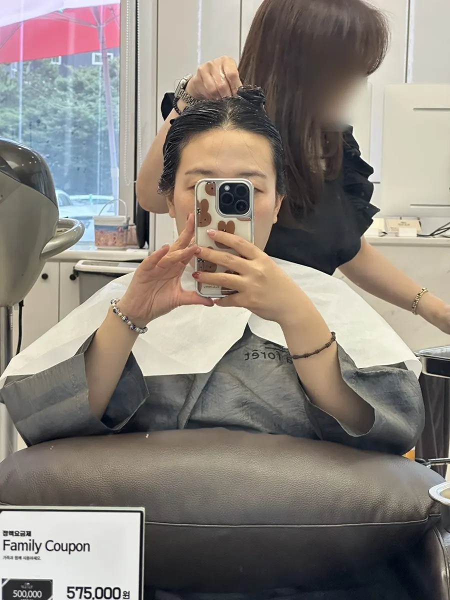 Hair twisted up to help absorb the clinic treatment