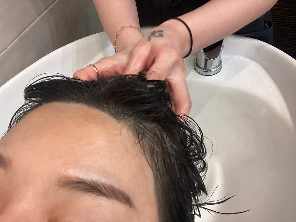 Applying LPP treatment at the shampoo station