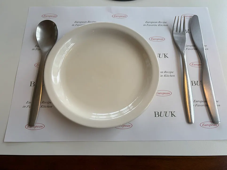 A neatly set dining table