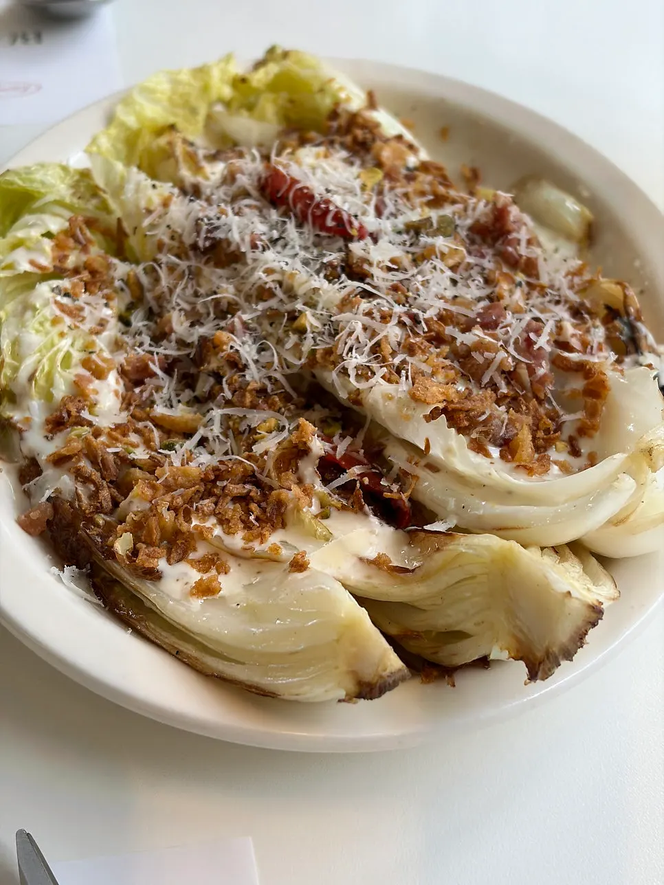 Meal served with napa cabbage Caesar salad