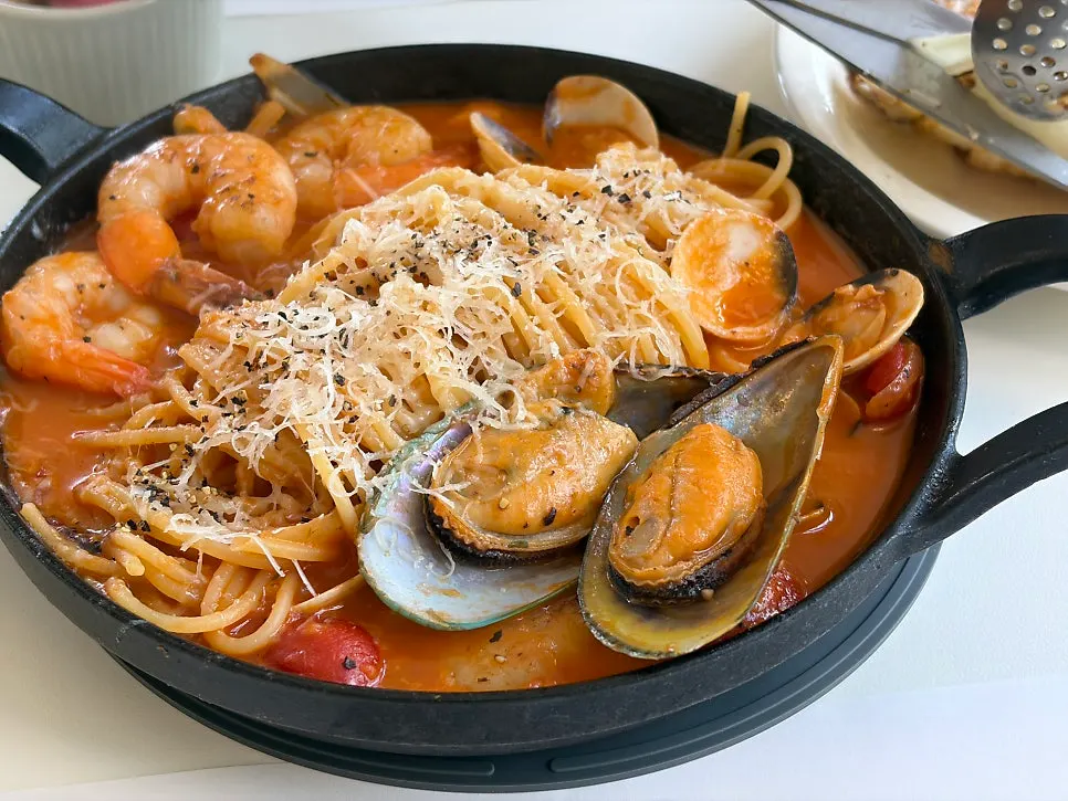 Seafood tomato ttukbaegi pasta