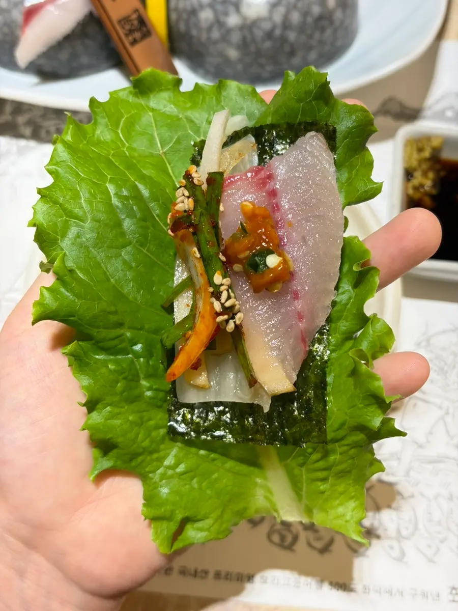 A plate of glossy mackerel sashimi