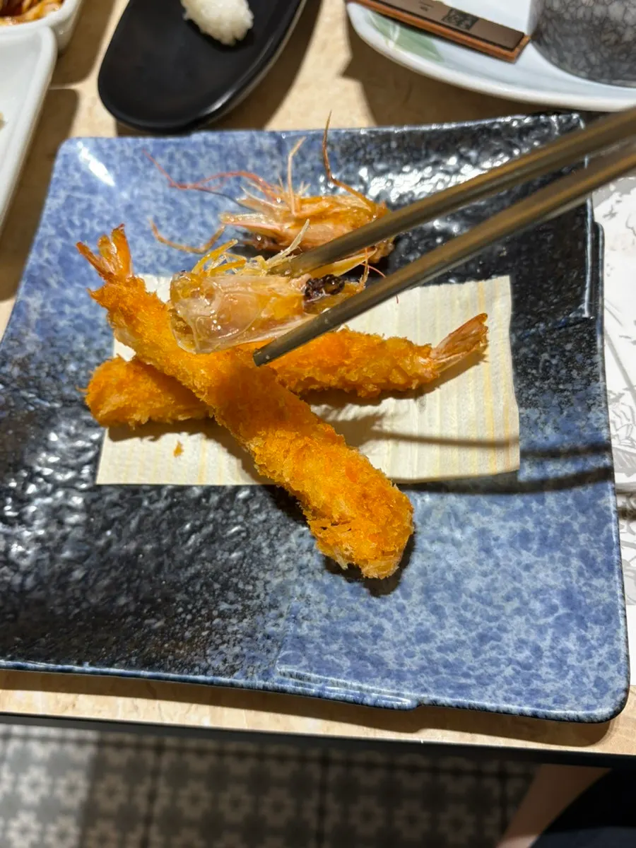 A sashimi plate emptied down to the last piece