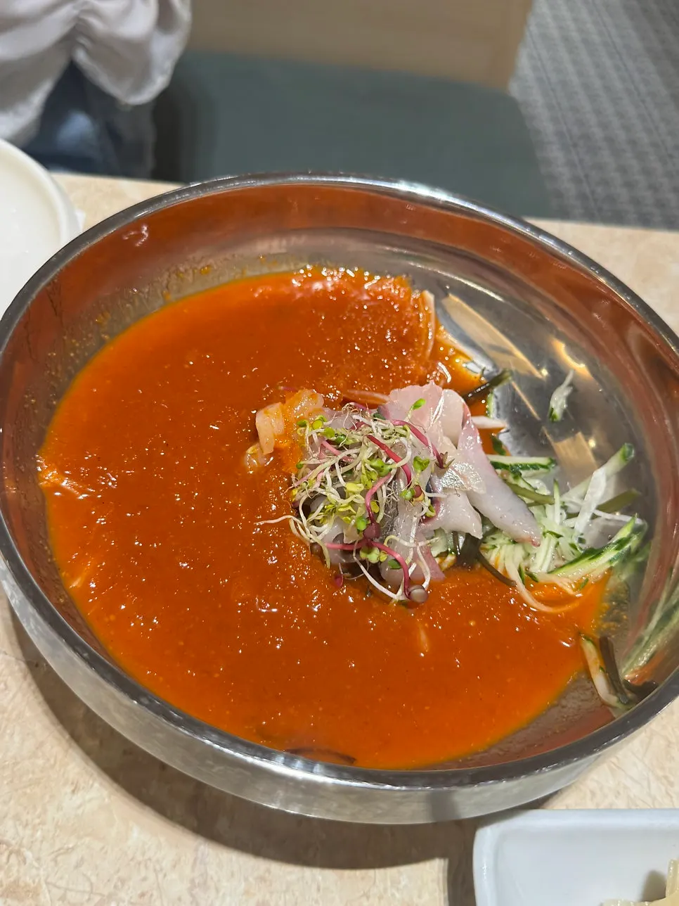 Basic table setting with salad, pickled ginger, and pickled onions