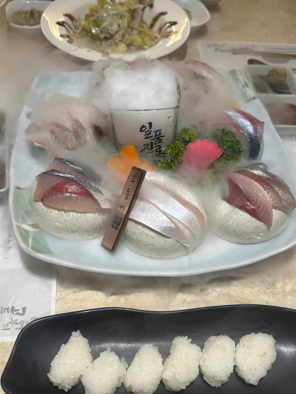 Sashimi plate rising with dry ice smoke