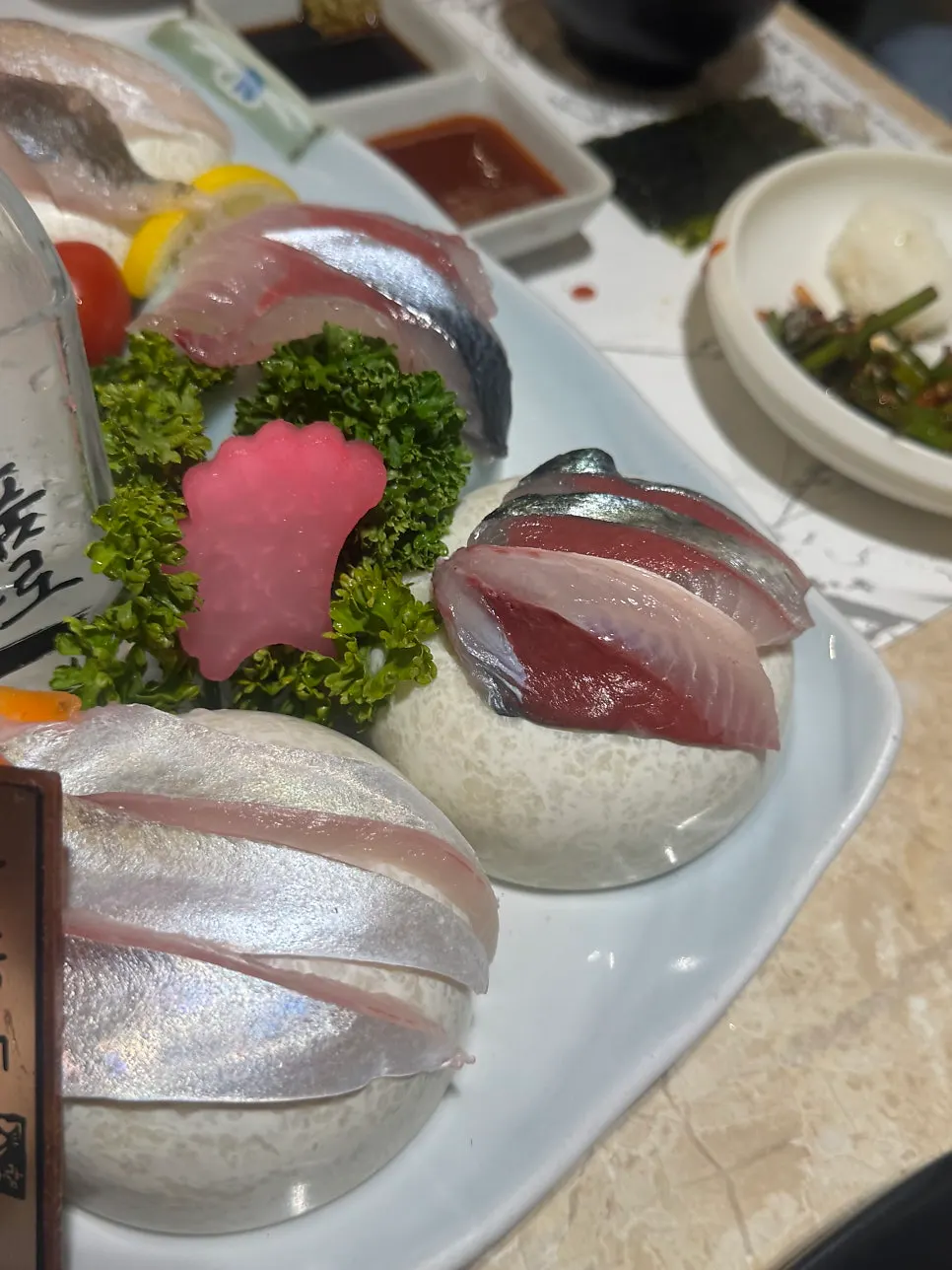 Mackerel and horse mackerel sashimi after the smoke clears