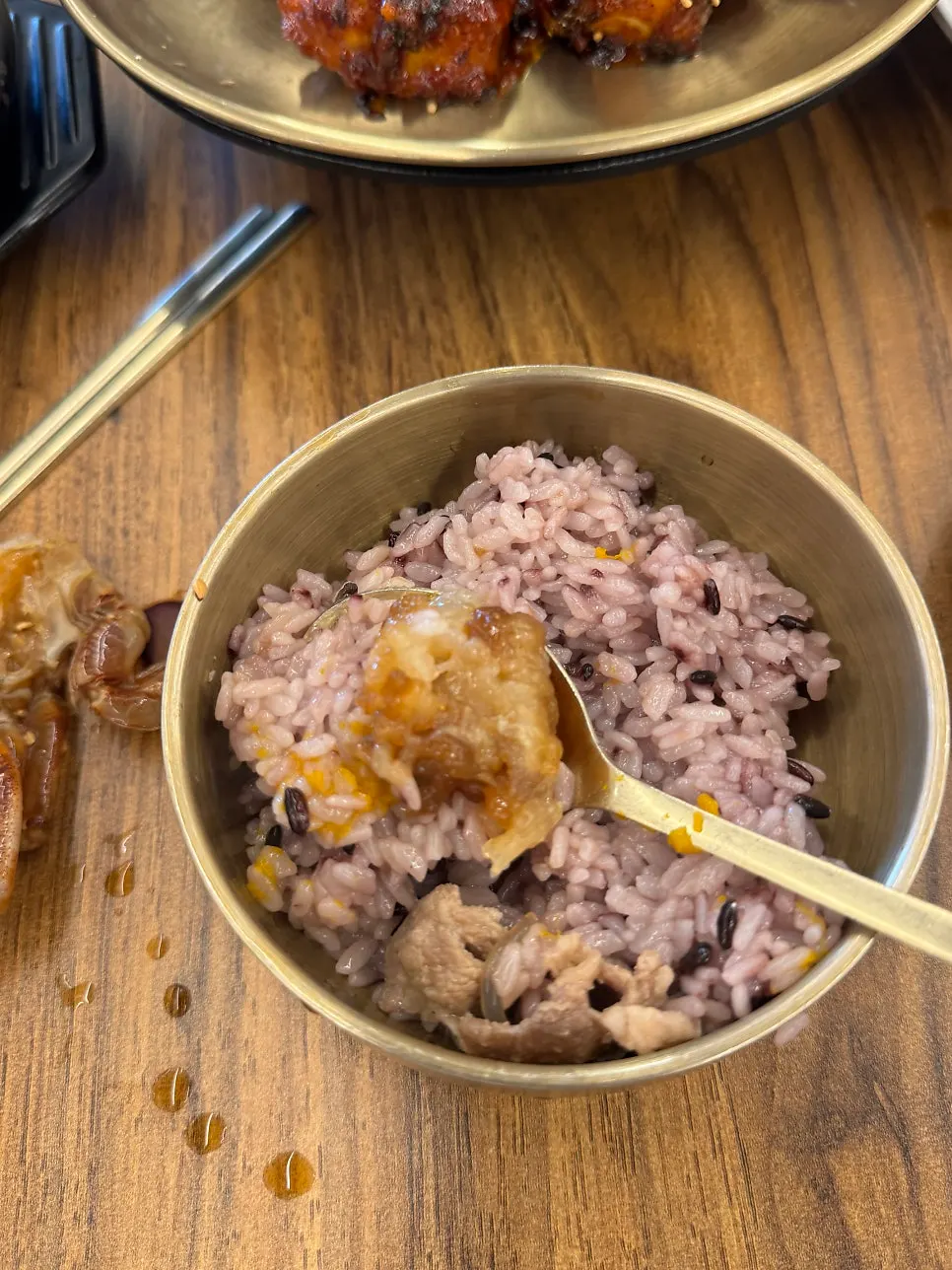 Soy-marinated crab and side dishes served as a full meal