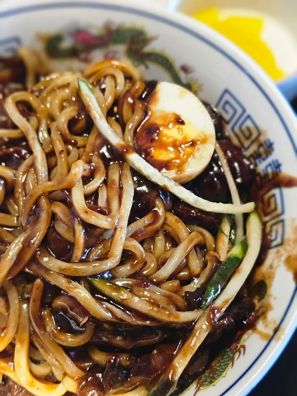 Jajangmyeon noodles lifted with chopsticks